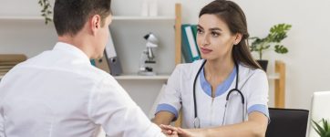 back-view-patient-talking-with-female-doctor